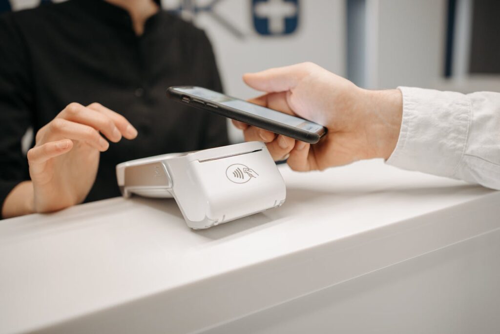pexels-photo-6812431 A Person Making Payment Using Smartphone